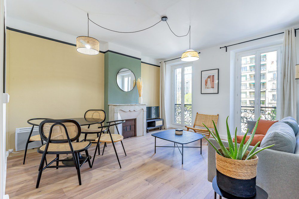 Living room with a sofa and a dinning space in a Marseilles' apartment