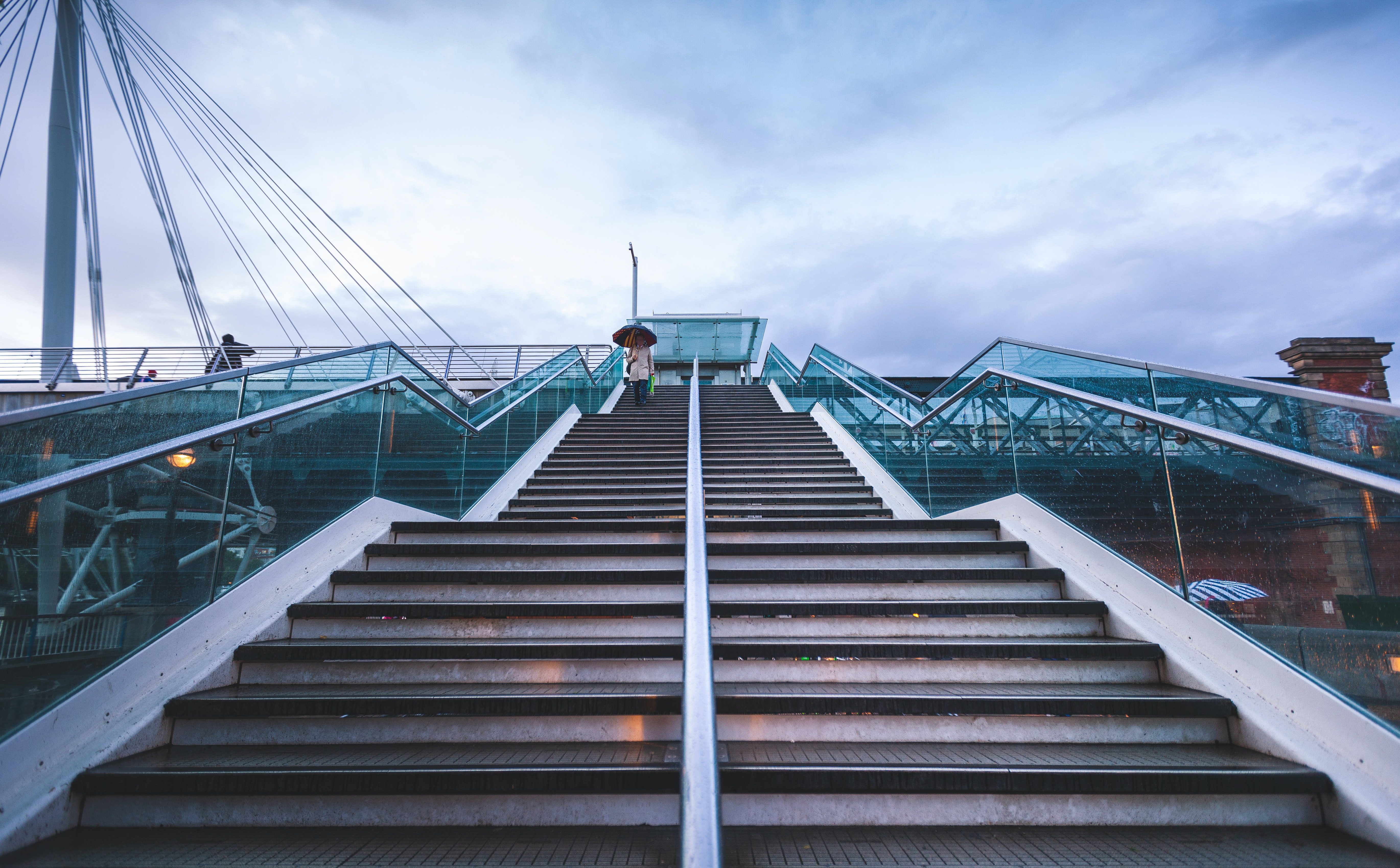 stairs and a man with an umbrella