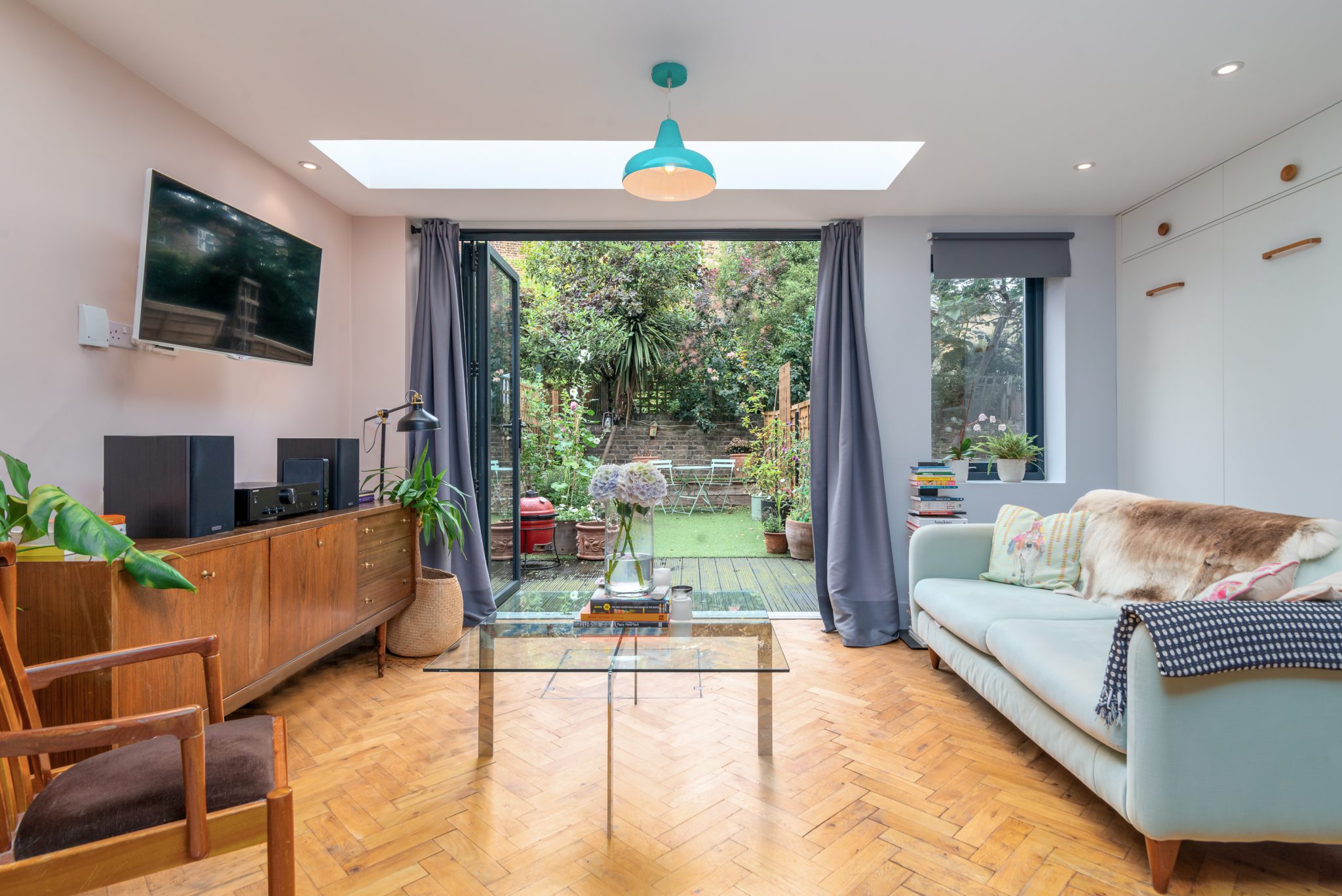 Apartment living room and garden managed by GuestReady