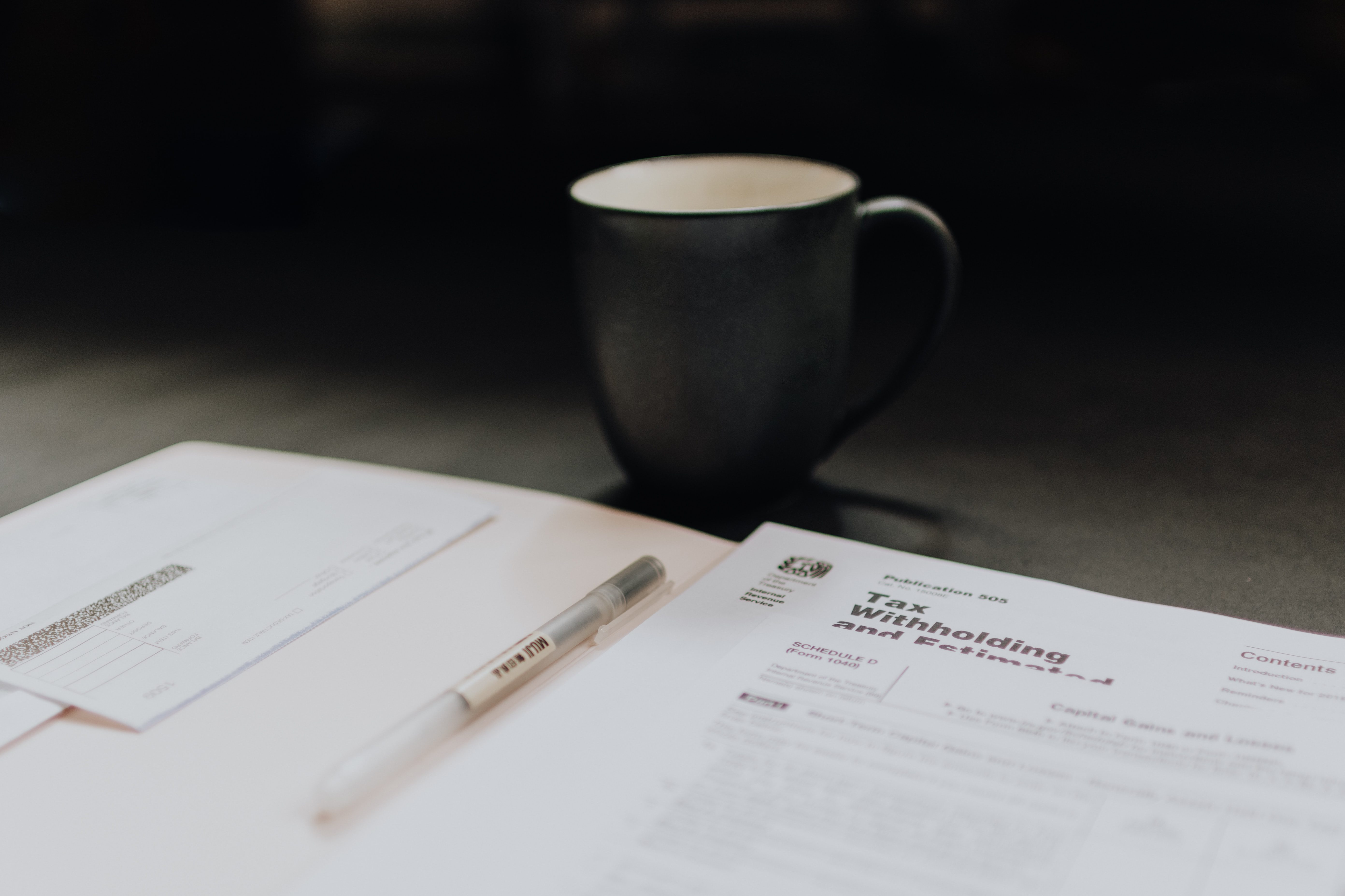 Coffee mug and paperwork